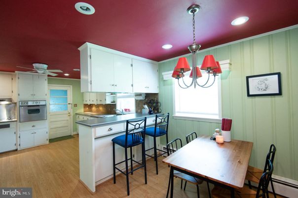 Chandelier, Dining room, Interior, Kitchen, Pendant Lights, Recessed Lighting, Stainless Steel Appliances, Wood Texture Flooring