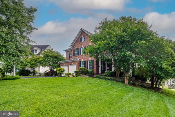 Attached, Backyard, Exterior, Facade, Brick Facade, Tudor Revival