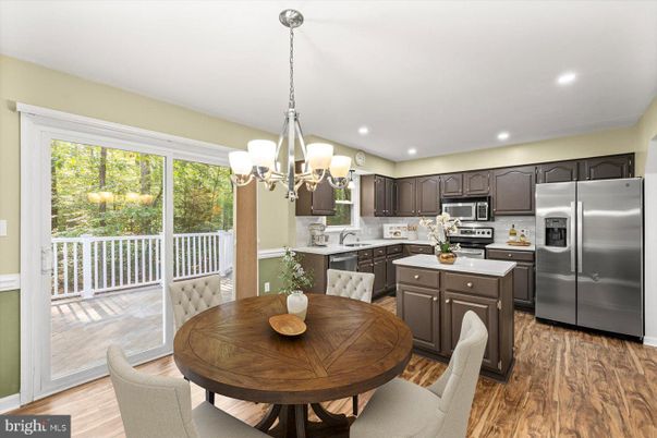 Chandelier, Dining room, Interior, Kitchen, Recessed Lighting, Stainless Steel Appliances, Wood Texture Flooring