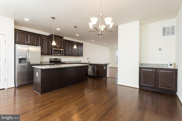 Chandelier, Interior, Kitchen, Pendant Lights, Recessed Lighting, Stainless Steel Appliances, Wood Texture Flooring
