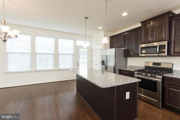 Chandelier, Interior, Kitchen, Pendant Lights, Recessed Lighting, Stainless Steel Appliances, Wood Texture Flooring