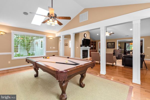 Billiard Table, Fireplace, Game Room, Interior, Living room, Recessed Lighting, Wood Texture Flooring