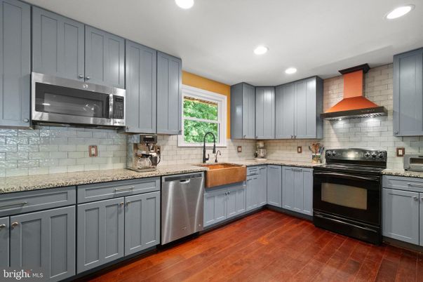 Interior, Kitchen, Recessed Lighting, Stainless Steel Appliances, Stone Walls, Wood Texture Flooring