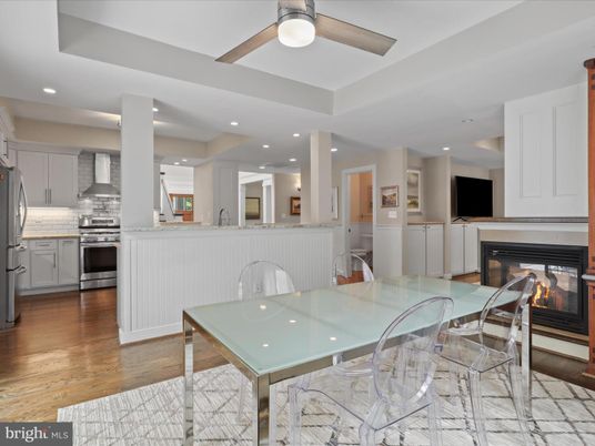Dining room, Fireplace, Interior, Kitchen, Recessed Lighting, Stainless Steel Appliances, Wood Texture Flooring