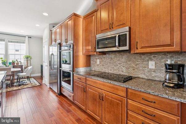 Dining room, Interior, Kitchen, Recessed Lighting, Stainless Steel Appliances, Wood Texture Flooring
