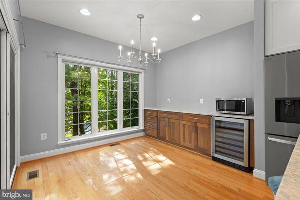 Empty room, Interior, Kitchen, Pendant Lights, Recessed Lighting, Stainless Steel Appliances, Wood Texture Flooring