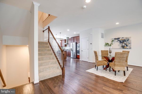 Dining room, Interior, Kitchen, Pendant Lights, Recessed Lighting, Stainless Steel Appliances, Wood Texture Flooring