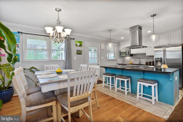 Chandelier, Dining room, Interior, Kitchen, Pendant Lights, Recessed Lighting, Stainless Steel Appliances, Wood Texture Flooring