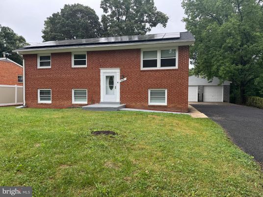 Attached, Exterior, Facade, Brick Facade, Solar Panels, Raised Ranch
