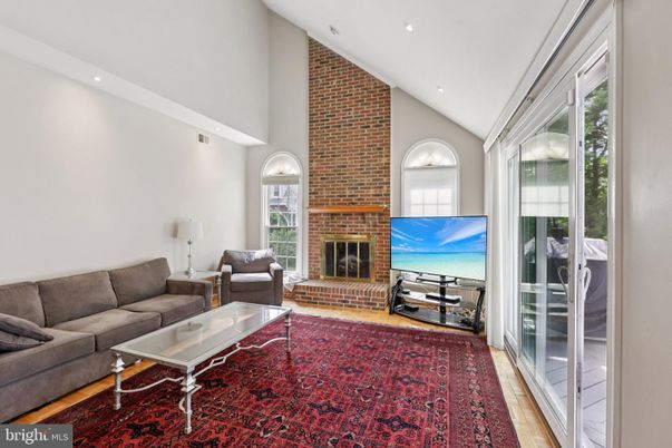 Fireplace, Interior, Living room, Recessed Lighting, Stone Walls, Wood Texture Flooring