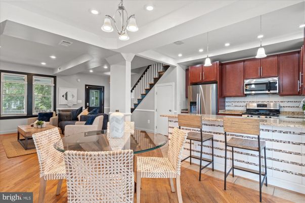 Dining room, Interior, Kitchen, Living room, Pendant Lights, Recessed Lighting, Stainless Steel Appliances, Wood Texture Flooring