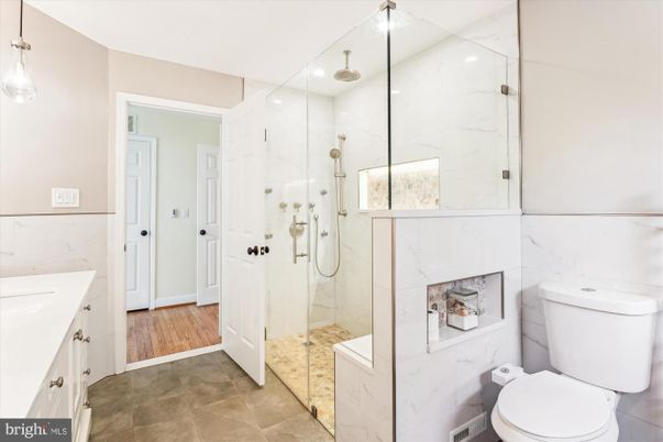 Bathroom, Glass Shower, Interior, Marble Walls, Recessed Lighting, Wood Texture Flooring