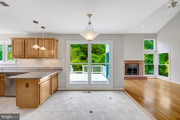 Empty room, Fireplace, Interior, Kitchen, Pendant Lights, Recessed Lighting, Wood Texture Flooring
