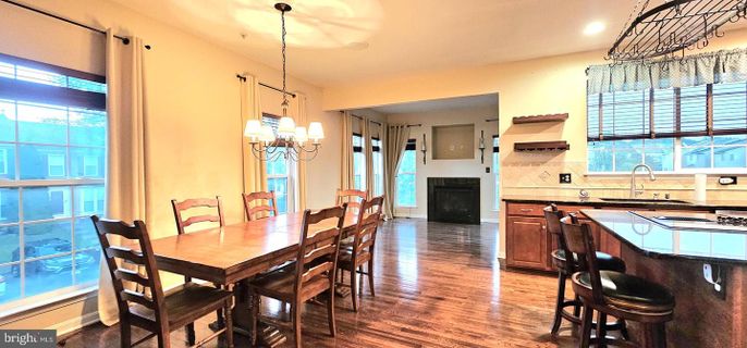 Chandelier, Dining room, Fireplace, Interior, Kitchen, Pendant Lights, Recessed Lighting, Wood Texture Flooring