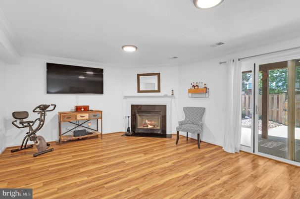 Fireplace, Fitness Equipment, Interior, Recessed Lighting, Wood Texture Flooring