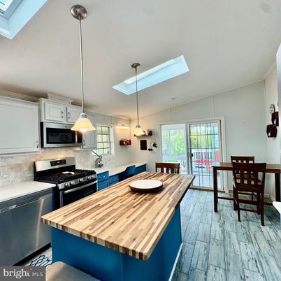 Dining room, Interior, Kitchen, Pendant Lights, Stainless Steel Appliances, Wood Texture Flooring