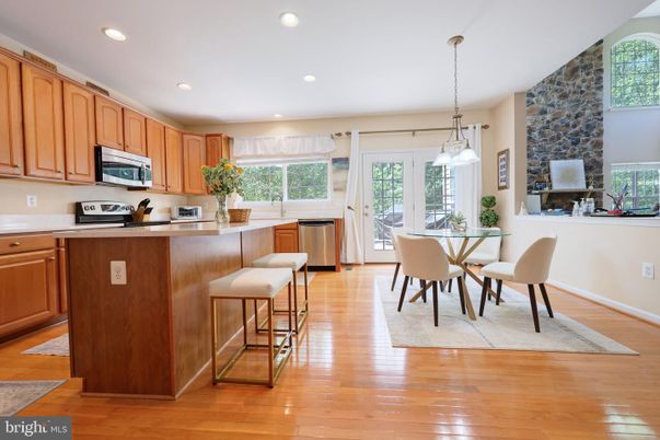 Dining room, Fireplace, Interior, Kitchen, Pendant Lights, Recessed Lighting, Stainless Steel Appliances, Wood Texture Flooring