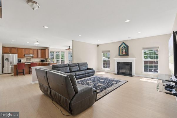 Fireplace, Interior, Kitchen, Living room, Recessed Lighting, Stainless Steel Appliances, Wood Texture Flooring