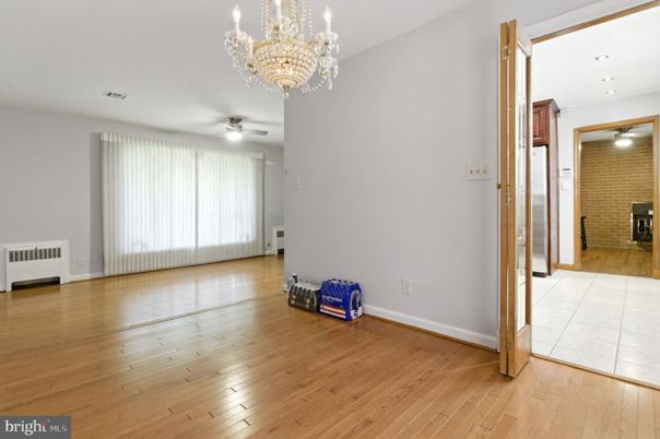 Chandelier, Empty room, Interior, Recessed Lighting, Stone Walls, Wood Texture Flooring
