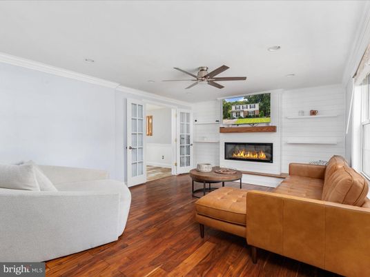 Fireplace, Interior, Living room, Recessed Lighting, Stone Walls, Wood Texture Flooring