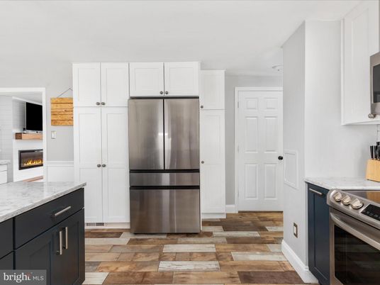 Fireplace, Interior, Kitchen, Stainless Steel Appliances, Wood Texture Flooring