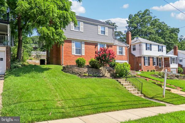 Attached, Exterior, Facade, Brick Facade, American Foursquare