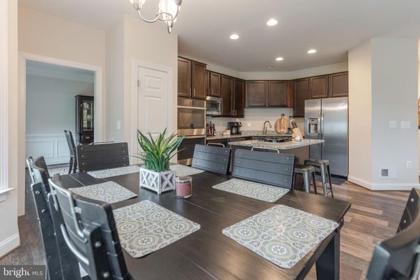 Dining room, Interior, Kitchen, Recessed Lighting, Stainless Steel Appliances, Wood Texture Flooring