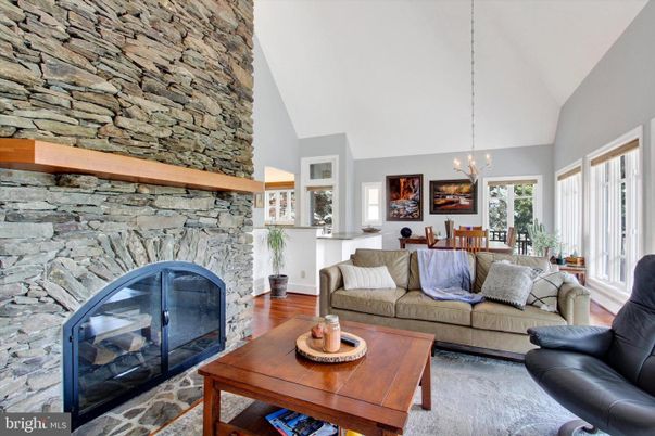 Dining room, Fireplace, Interior, Living room, Pendant Lights, Stone Walls, Wood Texture Flooring