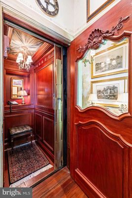 Chandelier, Elevator, Interior, Wood Texture Flooring, Wooden Walls