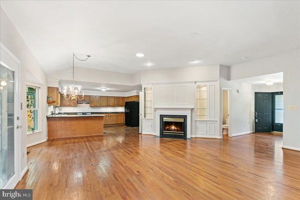 Chandelier, Empty room, Fireplace, Interior, Kitchen, Recessed Lighting, Wood Texture Flooring