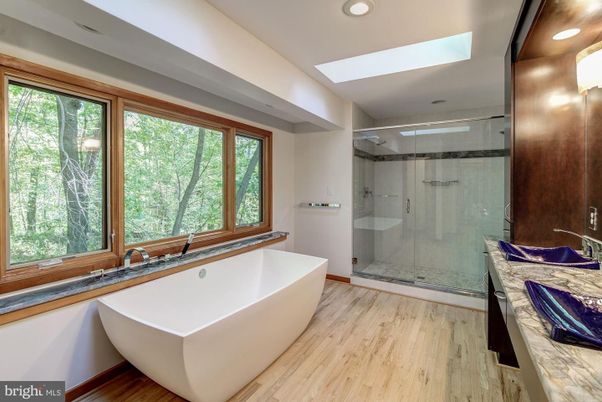 Bathroom, Free Standing Baths, Glass Shower, Interior, Recessed Lighting, Wood Texture Flooring