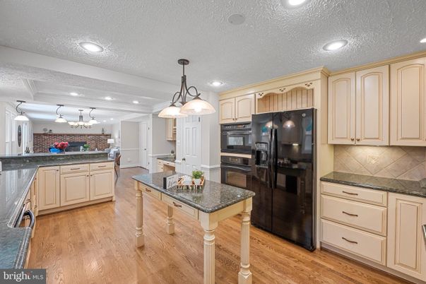Chandelier, Interior, Kitchen, Pendant Lights, Recessed Lighting, Stainless Steel Appliances, Wood Texture Flooring