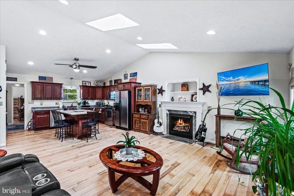 Dining room, Fireplace, Interior, Kitchen, Recessed Lighting, Wood Texture Flooring