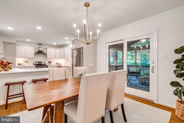 Chandelier, Dining room, Interior, Kitchen, Pendant Lights, Recessed Lighting, Stainless Steel Appliances, Wood Texture Flooring
