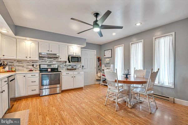 Dining room, Interior, Kitchen, Recessed Lighting, Stainless Steel Appliances, Wood Texture Flooring