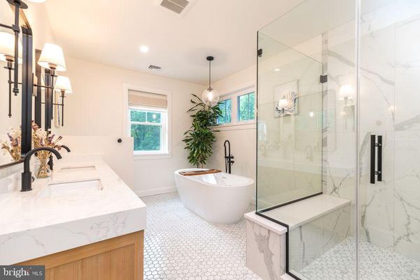 Bathroom, Dual Sink Vanities, Free Standing Baths, Glass Shower, Interior, Marble Walls, Pendant Lights, Recessed Lighting