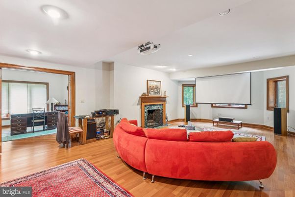 Fireplace, Interior, Living room, Projection Screen, Recessed Lighting, Wood Texture Flooring