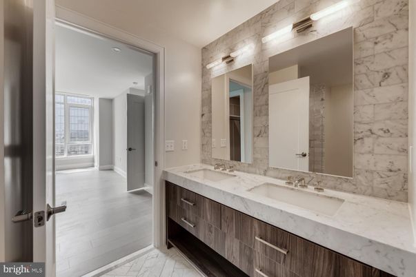 Bathroom, Dual Sink Vanities, Interior, Marble, Marble Walls, Wood Texture Flooring