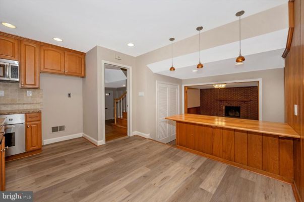 Fireplace, Interior, Kitchen, Pendant Lights, Recessed Lighting, Stainless Steel Appliances, Wood Texture Flooring