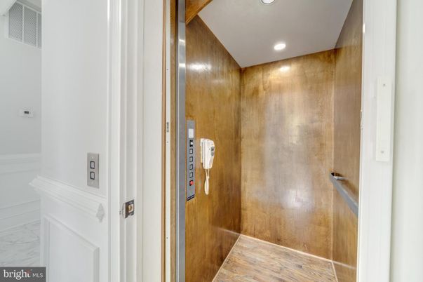 Elevator, Interior, Recessed Lighting, Wood Texture Flooring, Wooden Walls