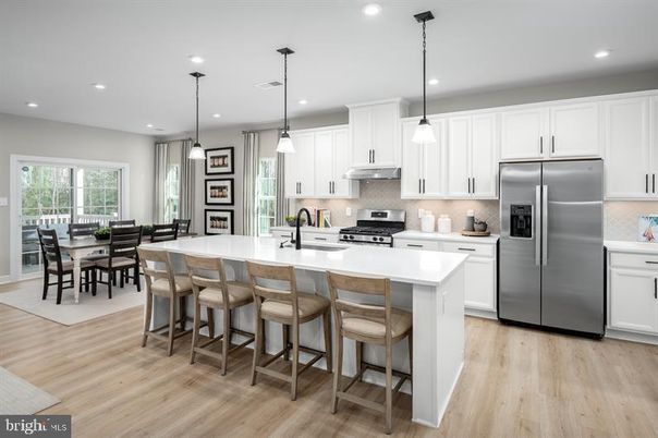 Dining room, Interior, Kitchen, Pendant Lights, Recessed Lighting, Stainless Steel Appliances, Wood Texture Flooring