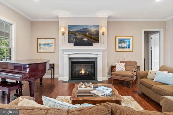 Fireplace, Interior, Living room, Piano, Recessed Lighting, Wood Texture Flooring