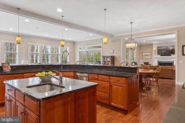 Dining room, Fireplace, Interior, Kitchen, Pendant Lights, Recessed Lighting, Stainless Steel Appliances, Wood Texture Flooring
