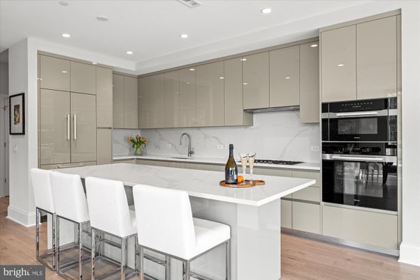 Interior, Kitchen, Marble Walls, Recessed Lighting, Stainless Steel Appliances, Wood Texture Flooring