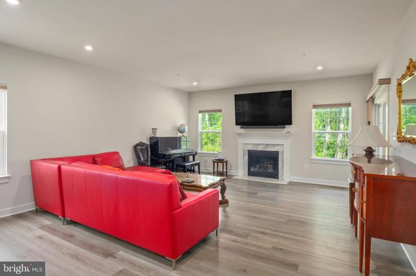 Fireplace, Interior, Living room, Piano, Recessed Lighting, Wood Texture Flooring