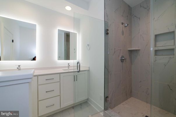 Bathroom, Dual Sink Vanities, Glass Shower, Interior, Marble, Marble Walls, Recessed Lighting