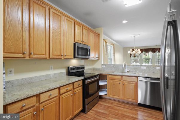 Chandelier, Interior, Kitchen, Pendant Lights, Recessed Lighting, Stainless Steel Appliances, Wood Texture Flooring