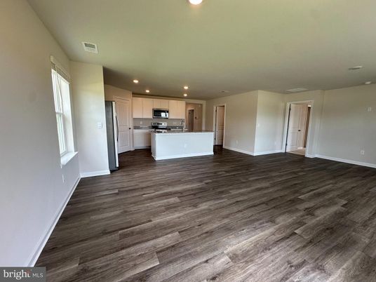 Empty room, Interior, Kitchen, Recessed Lighting, Stainless Steel Appliances, Wood Texture Flooring