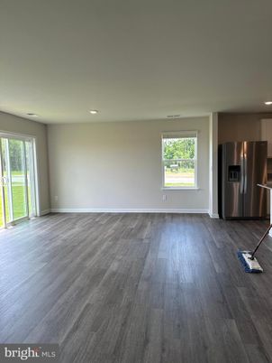 Empty room, Interior, Kitchen, Recessed Lighting, Stainless Steel Appliances, Wood Texture Flooring