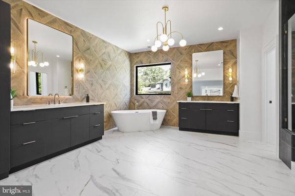 Bathroom, Chandelier, Dual Sink Vanities, Free Standing Baths, Interior, Marble, Marble Walls, Pendant Lights, Recessed Lighting